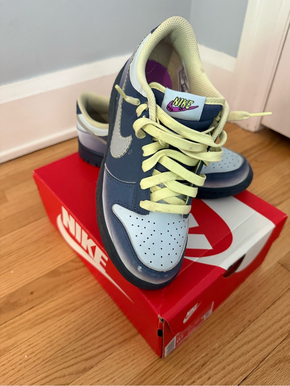 Nike Kids Low-Top Sneakers in Navy, Light Blue, and Pale Yellow